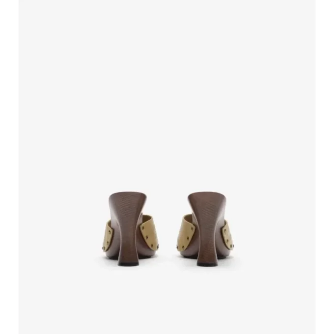 Mules in pelle con motivo a quadri