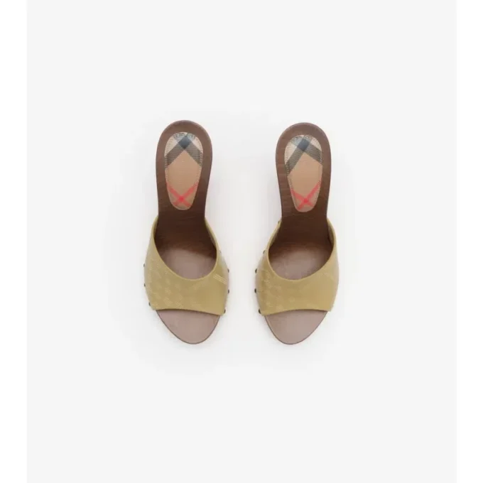 Mules in pelle con motivo a quadri