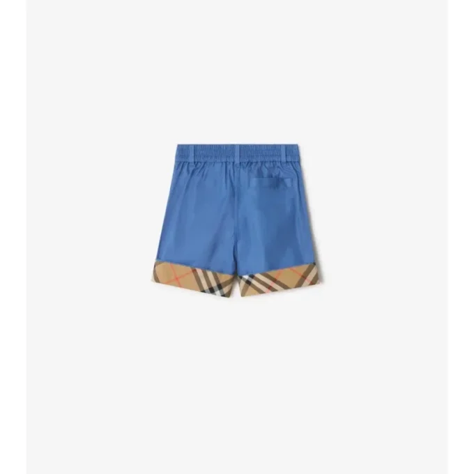 Pantaloncini in cotone con risvolto a quadri