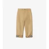 Pantaloni in cotone con risvolto a quadri