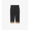 Pantaloni in cotone con risvolto a quadri
