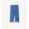 Pantaloni in cotone con risvolto a quadri