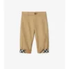 Pantaloni in cotone con risvolto a quadri