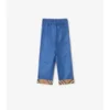 Pantaloni in cotone con risvolto a quadri