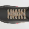 Sneakers in pelle con dettagli a righe