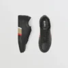 Sneakers in pelle con dettagli a righe
