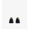 Sneakers in pelle e tessuto a quadri 