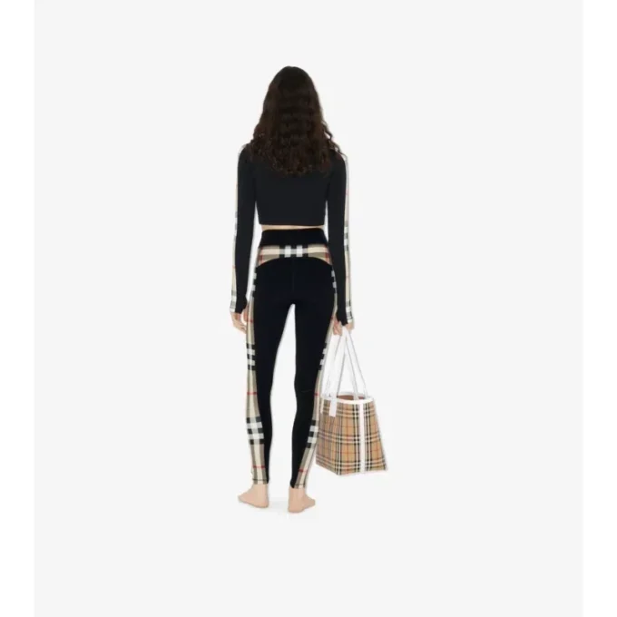 Top corto in jersey elasticizzato con zip e bordi a quadri